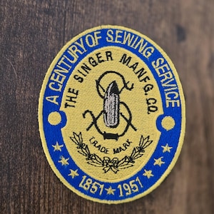 Singer Centennial-emblem i 4 storlekar för direktsömnad eller lapp