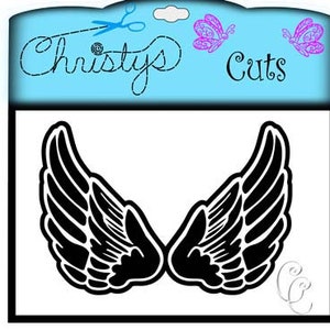 May include: Black silhouette of angel wings on a white background. The wings are large and detailed, with a feathery texture. The image is perfect for crafting projects, scrapbooking, or adding a touch of whimsy to any design.