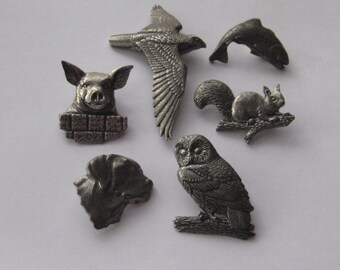 Collection of A R Brown pewter brooches