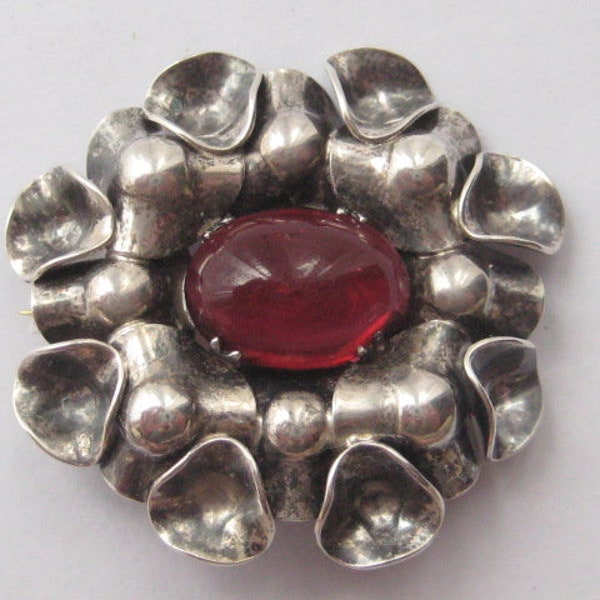 Modernist silver garnet paste cabochon brooch