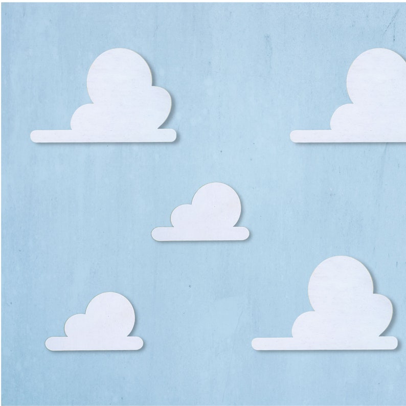 May include: Five white paper clouds against a light blue background. The clouds are cut out and have a shadow effect.