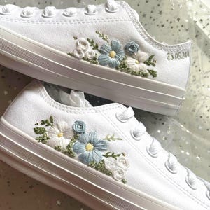 May include: A set of three ceramic mugs with a speckled, matte finish. The mugs are in shades of cream, light gray, and dark gray. Each mug has a simple, minimalist design, perfect for coffee or tea.