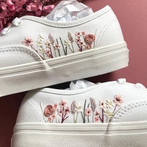 May include: A rustic wooden sign with the text "Welcome to our home" in a handwritten style. The sign features a distressed finish and a simple, inviting design, perfect for entryway decor.