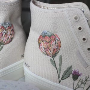 Hand Embroidered king protea and thistle Wedding Shoes: Custom Bridal Sneakers