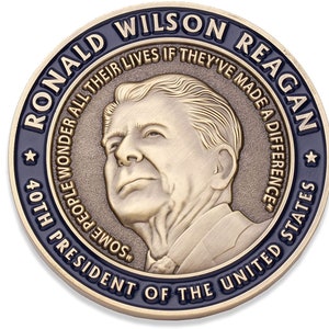 May include: A bronze-colored commemorative coin featuring a portrait of Ronald Wilson Reagan. The coin's outer ring is dark blue with the text "RONALD WILSON REAGAN" and "PRESIDENT OF THE UNITED STATES." The coin also includes the quote, "SOME PEOPLE WONDER ALL THEIR LIVES IF THEY'VE MADE A DIFFERENCE."