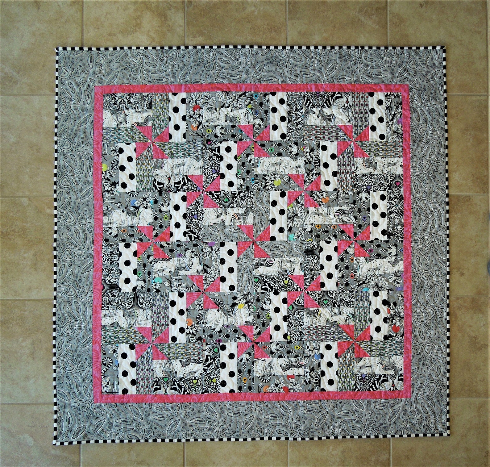 Black and White and Pink All Over is a Crib Size Quilt in Fabrics From