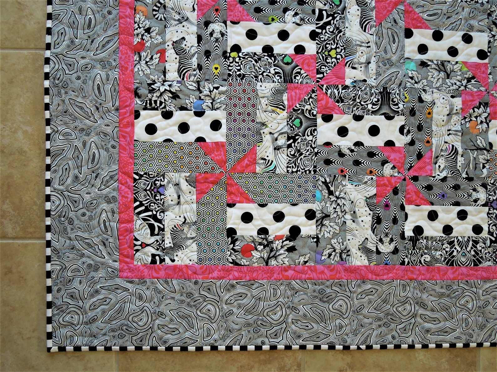 Black and White and Pink All Over is a Crib Size Quilt in Fabrics From