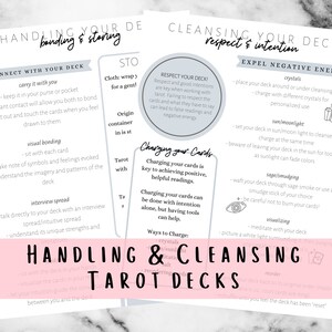 May include: A pink and white illustrated guide with the text "Handling & Cleansing Tarot Decks" on how to care for and cleanse tarot cards. The guide includes sections on connecting with your deck, visual bonding, interview spreads, charging your cards, and expelling negative energy.