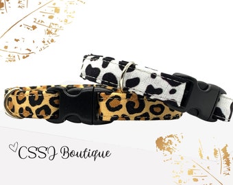 May include: Two adjustable pet collars with a leopard print design. One collar is white with black spots and the other is brown with black spots. Both collars have black buckles.