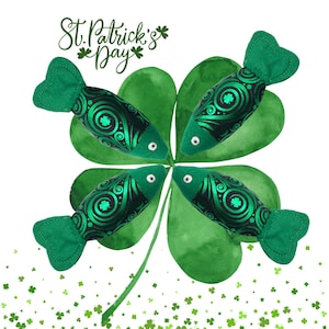 May include: Four green felt fish with black and green swirl patterns are arranged around a green four-leaf clover. The clover is painted on a white background with a scattering of green shamrocks. The text "St. Patrick's Day" is written in black cursive above the clover.
