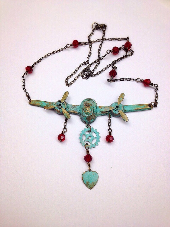 Items similar to Two Propeller Plane Necklace on Etsy