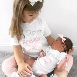 Matching Big/Little Sister T-Shirts. Envelope Sleeve Bodysuit or Top with Glitter and Bow Detail.