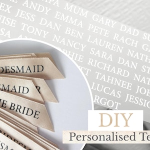 May include: A collection of beige satin ribbons arranged in a fan shape, each printed with black text including "BRIDESMAID" and "MOTHER OF THE BRIDE." A circular overlay shows a grey background with white printed names like "ALEX," "JESS," and "DAN."