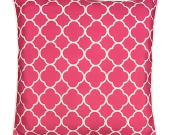 May include: Pink throw pillow with a white geometric pattern. The pillow has a white border.