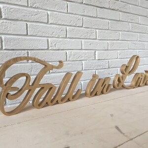 Fall in love sign. Love gold sign. lovely home decoration. Standing sign or a wall decor sign, romantic saying, love