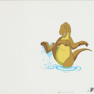 May include: A cartoon dinosaur with brown and yellow skin is standing in a pool of blue water. The dinosaur is shaking its foot, causing water to splash.