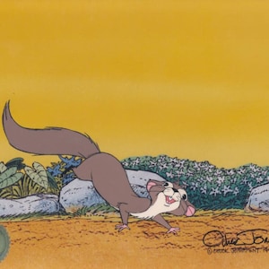 May include: A cartoon illustration of a brown and gray squirrel with a white belly and pink nose, running on a dirt path with green plants and rocks in the background. The sky is yellow. The image is signed "Chuck Jones" and dated 1945.