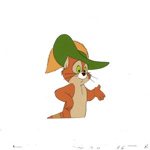 May include: A cartoon cat wearing a green hat with a feather. The cat has orange fur and green eyes. The cat is looking to the right and has its right paw raised.