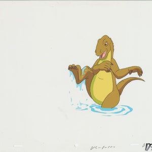 May include: A cartoon dinosaur with a yellow belly and brown back is standing in a pool of water. The dinosaur is lifting its right leg out of the water, and water is splashing from its foot.