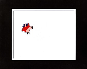 May include: A cartoon image of a red fox head wearing a blue hat and a black bow tie. The fox is set against a white background, framed by a black border.