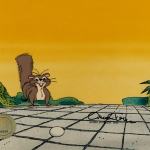 May include: A cartoon squirrel with a bushy tail stands on a tiled patio with a white egg in the foreground. The background is a yellow sunset with a palm tree on the right side of the image.