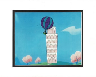 May include: A cartoon illustration of a hot air balloon with purple and blue stripes, crashing into the Leaning Tower of Pisa. The tower is white and pink with arched windows. The background is a blue sky with white clouds and two pink trees.