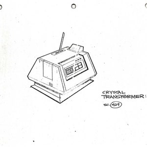 May include: A black and white line drawing of a futuristic device with a small antenna on top. The device has a rectangular screen with a series of buttons and a label that reads "CRYSTAL TRANSFORMER: SC 429".