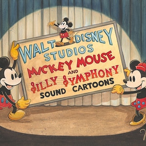 May include: Mickey Mouse and Minnie Mouse holding a sign that reads "Walt Disney Studios Mickey Mouse and Silly Symphony Sound Cartoons". The sign is on a stage with a blue curtain in the background.