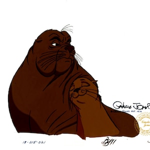 May include: An illustration of two cartoon seals, one large and brown, the other smaller and tan, in a tender embrace. The larger seal has a stern expression. The image has text and a signature.