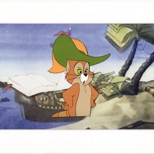 May include: A cartoon cat wearing a green hat with a red feather. The cat is standing on a white surface with a book and a wooden structure in the background.
