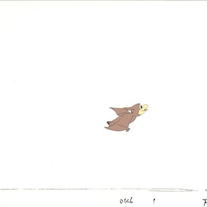 May include: A cartoon illustration of a brown pterodactyl with yellow eyes and a beak, flying with its wings spread out.