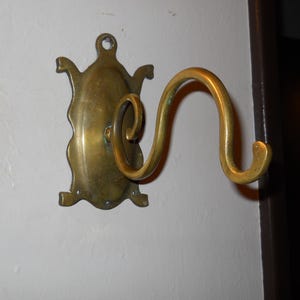 Vintage Brass Medallion Wall Hook 8" Long Curved Arm