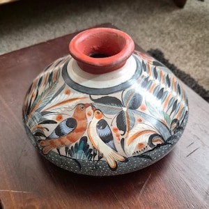 May include: A rustic wooden sign with the text "Welcome to our home" in a handwritten style. The sign features a distressed finish and a simple, inviting design, perfect for entryway decor.