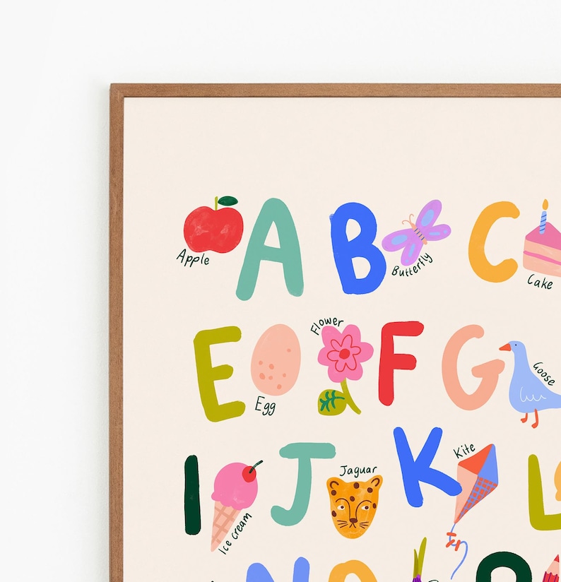 May include: Alphabet art print featuring colorful letters and illustrations. Includes an apple, butterfly, cake, egg, flower, goose, ice cream, jaguar, and kite. The letters are in various colors, with corresponding images for each letter.