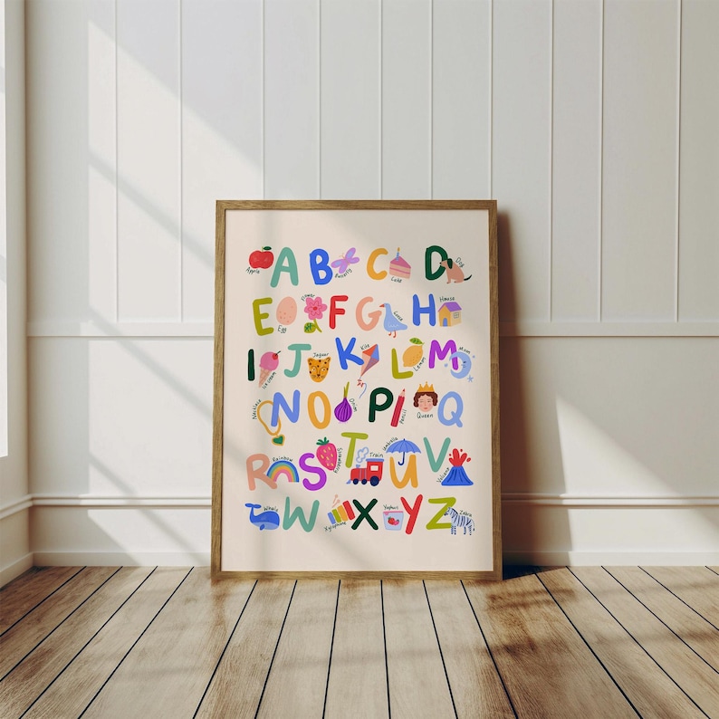 May include: A framed alphabet poster with colorful illustrations for each letter. The letters are in a variety of bright colors and are accompanied by corresponding images, such as an apple for A and a zebra for Z. The poster is in a wooden frame.