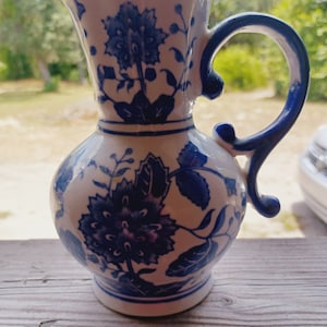 Formalities. blue white wall pocket by baum bros.