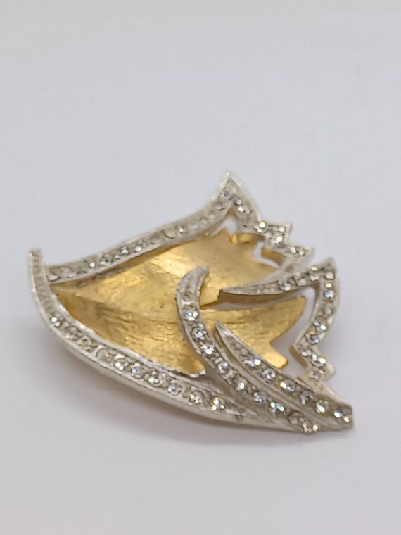 Vintage golden silver brooch with rhinstones