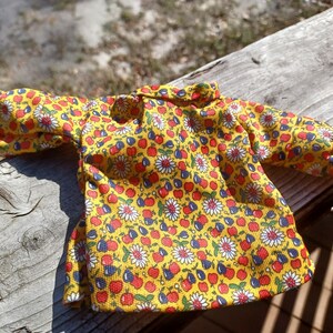 Vintage 60s Barbie yellow dress with fruit and flowers.