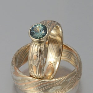 Custom Mokume Gane ring - 14 rose gold, 14k palladium white gold and silver with teal sapphire