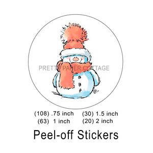 May include: A set of peel-off stickers featuring a snowman wearing a red and white hat and scarf. The stickers are available in three sizes: 0.75 inch, 1 inch, and 1.5 inch.