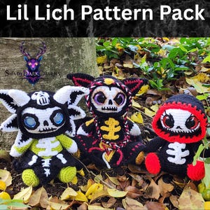 May include: Three crocheted skeleton dolls in a woodland scene. The dolls are black, white, red, and yellow. The text "Lil Lich Pattern Pack" is at the top of the image.