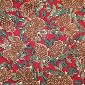 May include: Red fabric with a repeating pattern of brown pine cones, green holly leaves, and white dots.