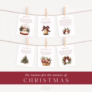 Könnte beinhalten: Sechs Weihnachtskarten hängen mit Holzklammern an einer Schnur. Jede Karte zeigt Aquarellillustrationen einer Schneekugel, einer Glocke, Ornamente, eines Weihnachtsbaums, Geschenke und einen Kranz. Der Text "the reason for the season of CHRISTMAS" steht unten.