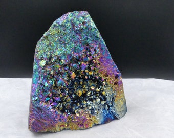 Aqua Aura: rainbow-colored glittering amethyst geode coated with titanium vapor.