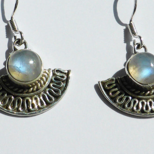 Finely crafted silver earrings with round moon stone