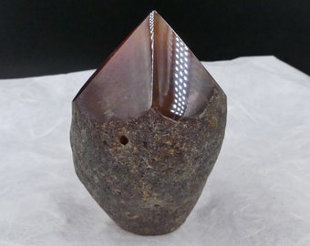 Agate sculpture with shiny polished tip