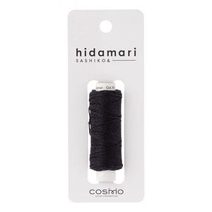 May include: A spool of black thread labeled "hidamari SASHIKO &" on a white card. The thread is tightly wound and ready for use. The card also features the "cosmo" logo.