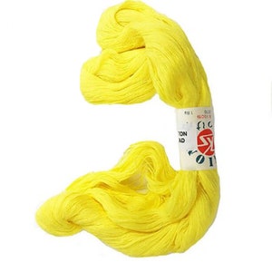 May include: A skein of bright yellow cotton thread. The label reads "Cotton Thread" and has a red circle with a white "SK" inside.