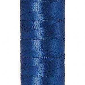 May include: A spool of blue metallic thread. The thread is tightly wound around a white spool. The top of the spool has the word "Mettler" printed on it. The bottom of the spool has the number "40" and "100m/109yds" printed on it.