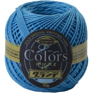 May include: A ball of light blue knitting yarn with a label that reads "GOLD SPECIAL KNITTING YARN" and "Colors". The label also includes Japanese text and the weight of the yarn, 10g.